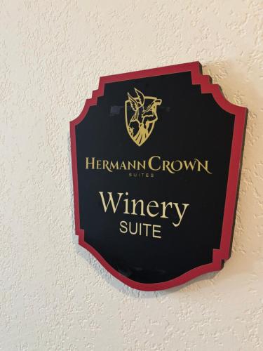 a sign for the hermann brown winery suite on a wall at Hermann Crown Suites in Hermann