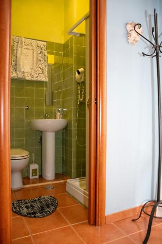 a bathroom with a sink and a toilet at The Oaks in Spigno Saturnia