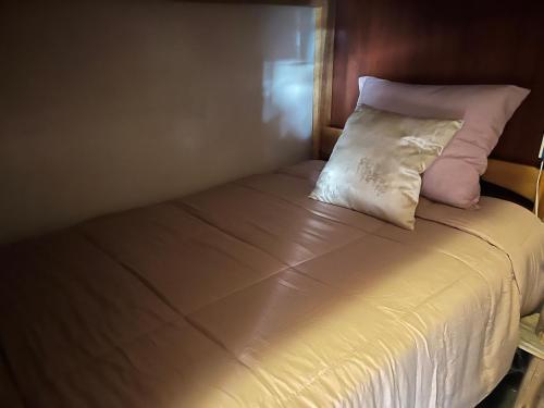 Ένα ή περισσότερα κρεβάτια σε δωμάτιο στο Intihuatana Hostel