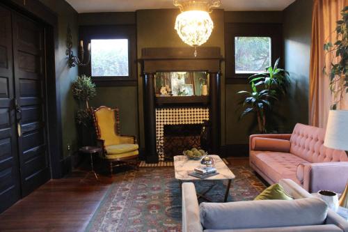 a living room with a couch and a table at Stylish Casa Mina Downtown Free Parking in El Paso