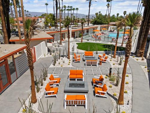 an aerial view of a resort with chairs and a pool at Mojave Resort - Adults Only in Palm Desert
