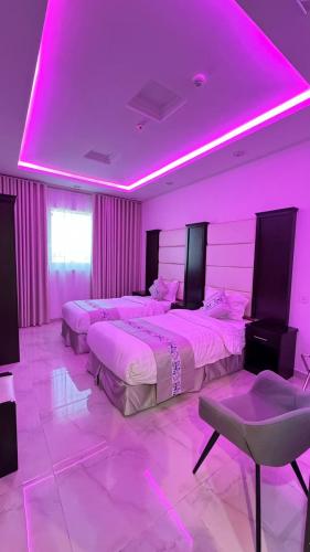 Ένα ή περισσότερα κρεβάτια σε δωμάτιο στο أبراج البيعة للشقق المخدومة