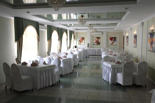 a large room filled with tables and chairs at Hotel Mars in Lviv