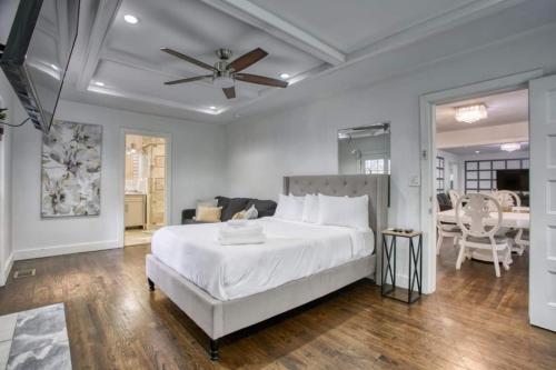 a bedroom with a large bed with a ceiling fan at Buckhead 8BR GetawayOpen Layout,Ideal for Groups in Atlanta