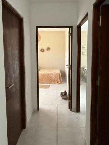 an open doorway to a bedroom with a bed at Duplex Vistas, Resistencia Chaco in Resistencia