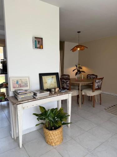 a living room with a table and a dining room at Duplex Vistas, Resistencia Chaco in Resistencia
