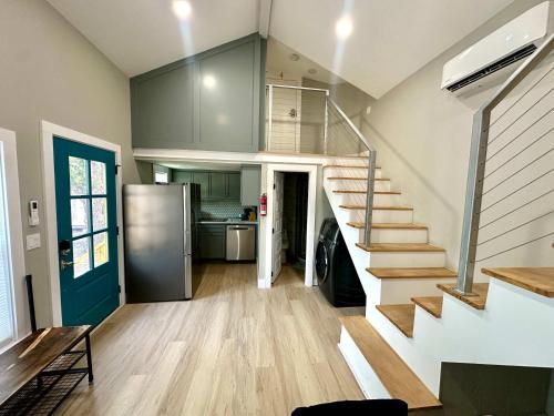 a kitchen with a staircase in a house at Tiny Private Room #3 in Shared 5BR House with Other Guests in Austin
