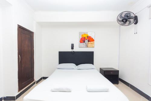 Ένα ή περισσότερα κρεβάτια σε δωμάτιο στο Hotel Villa Real