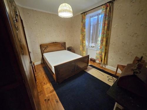 Una cama o camas en una habitación de Gite du menuisier