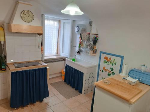 a kitchen with a sink and a counter top at La Casa del Castello in Alvito