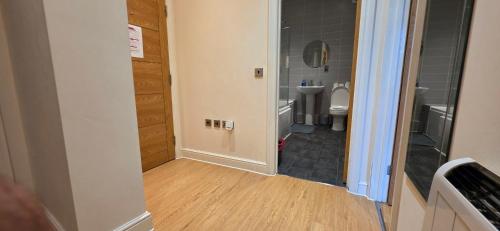 a small bathroom with a toilet and a sink at Modern 2 bedrooms apartment in Town centre in Ipswich