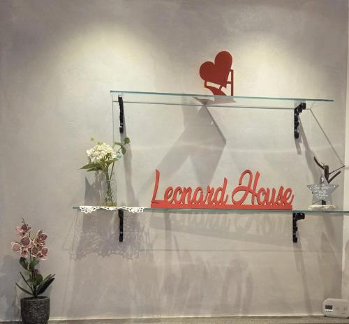 a glass shelf with a sign that reads normal lane at Leonard Chalet House in Albiano