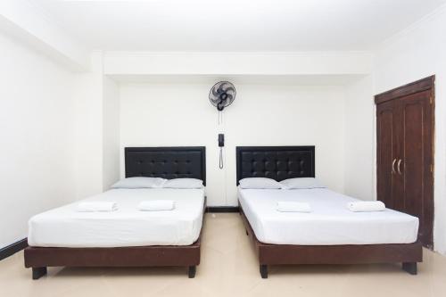 Ένα ή περισσότερα κρεβάτια σε δωμάτιο στο Hotel Villa Real