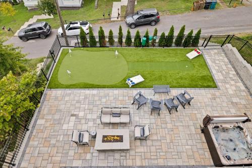 an aerial view of a yard with a golf course at 2mi Downtown Hot Tub Balcony 4 King Beds in Nashville