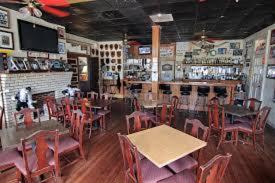 a dining room with tables and chairs in a restaurant at Riverview Hotel in Saint Marys