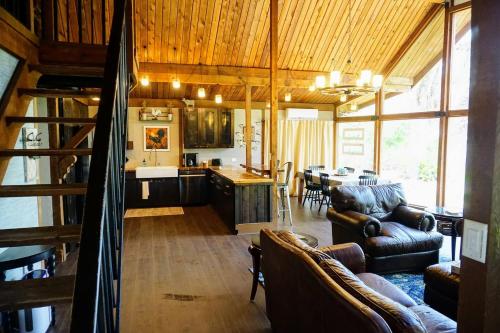 a living room with a kitchen and a dining room at The Nature House in Hernando