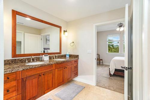 a bathroom with a sink and a mirror at Last Min Prices! Kiahuna Escape - AC, Pool, Golf in Koloa
