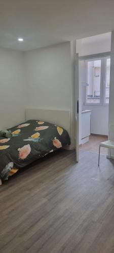 a bedroom with a bed and a desk and a chair at CitySpot 159 in Brussels