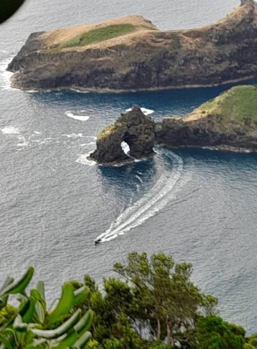 an island in the middle of a body of water at Casa vicente in Santa Cruz das Flores