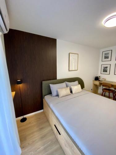 a bedroom with a large bed in a room at Studio8 centerapartment Prizren in Prizren