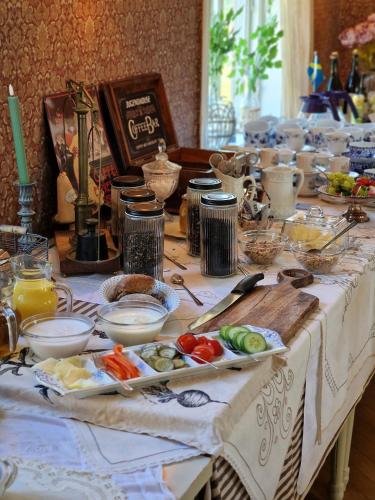 a long table with food on top of it at Jugendhouse - Klevs Gästgiveri in Mårdaklev