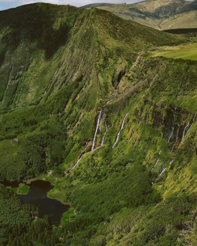 an aerial view of a mountain with a waterfall at Casa vicente in Santa Cruz das Flores
