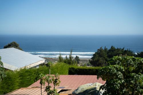 a view of the ocean from the roof of a house at Viento Sur Pichilemu Lodges in Pichilemu