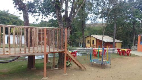 a park with a playground with a swing at Chalé Inhambu Tiradentes in Tiradentes