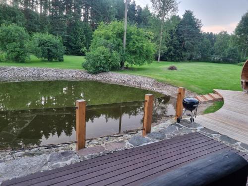 a pond in the middle of a wooden deck at Vana-Paradiisi in Uulu
