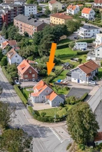 an aerial view of a suburb with a yellow arrow at Strömspärlan - Nordic Stay Strömstad in Strömstad