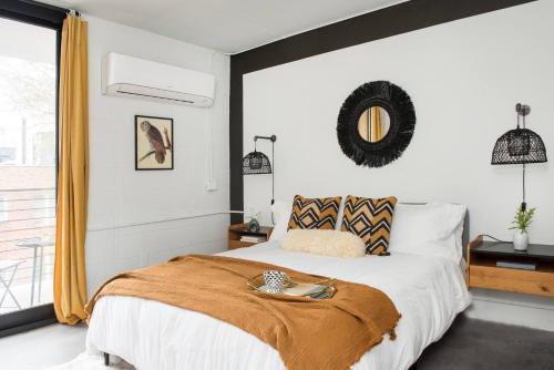 a bedroom with a large bed and a window at THE MANDO, walkable to PonceCityMarket in Atlanta