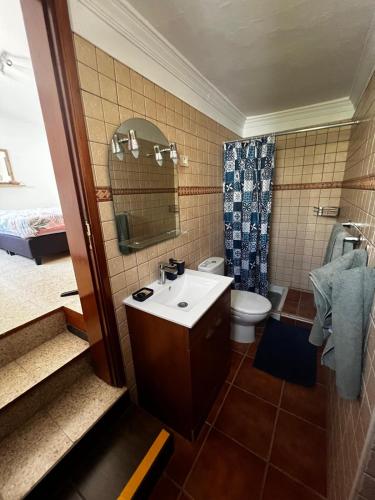 a bathroom with a sink and a toilet at Casa Colonia in Mogán