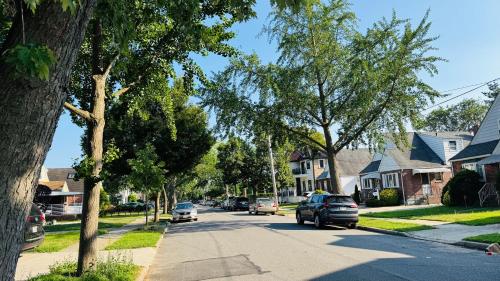 a street in a residential neighborhood with cars parked at Line&Light 