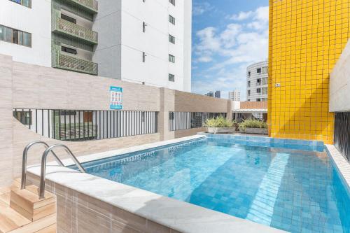 a swimming pool on top of a building at Apartamento com vista incrível e piscina - GS501 in Recife