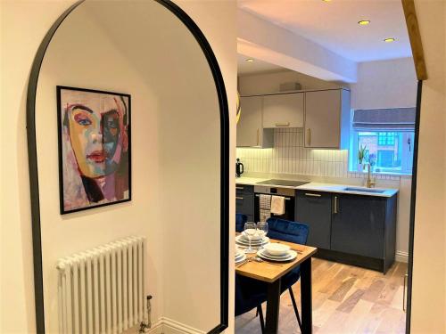 a kitchen and dining room with a table and a mirror at Escape 2 Unwind, Minster Retreat - Sleeps 5 in York