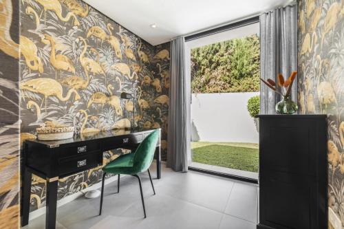 a home office with a desk and a green chair at Sunset Villa With Pool in Bodrum City