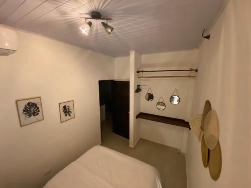 a room with a bed and a ceiling fan at BHB - ApartaHotel in Leticia