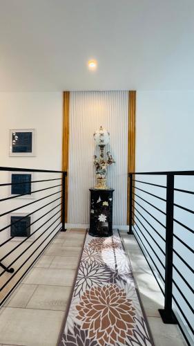 a large room with a table and a clock on the wall at Fancy private home 