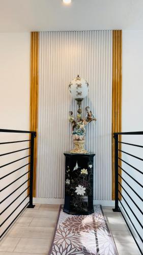 a room with a clock on top of a table at Fancy private home 