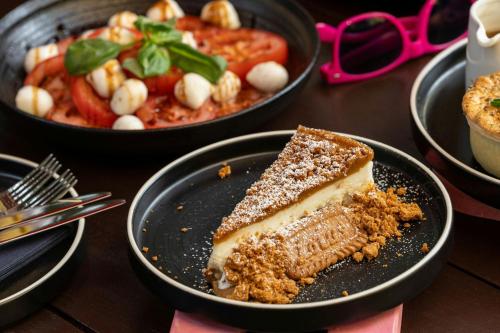 a piece of cake on a plate on a table at Moxy York in York