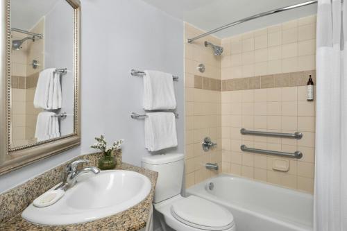 a bathroom with a sink and a toilet and a tub at Marriott's Harbour Point and Sunset Pointe at Shelter Cove in Hilton Head Island