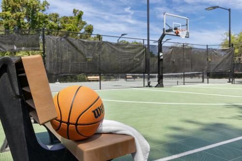 a basketball sitting on a bench on a tennis court at Marriott's Harbour Point and Sunset Pointe at Shelter Cove in Hilton Head Island