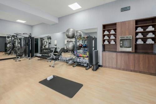 a fitness room with a gym with equipment at Four Points by Sheraton College Park Atlanta Airport in Atlanta