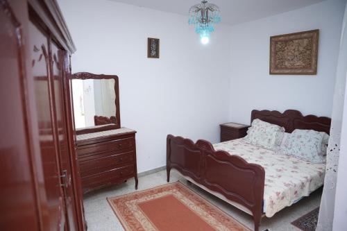 Postel nebo postele na pokoji v ubytování Dar Sousse