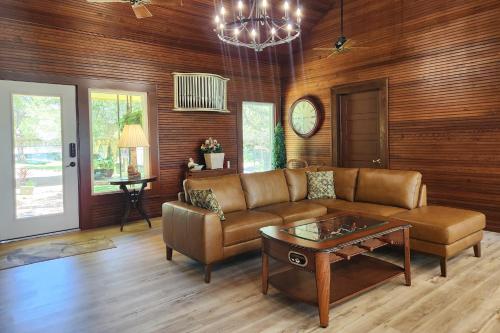 a living room with a couch and a coffee table at The Lakehouse on Clear Lake in Seabrook