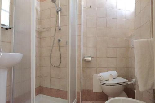 Koupelna v ubytování Hotel Bacco