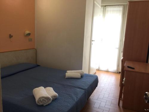 Postel nebo postele na pokoji v ubytování Hotel Bacco