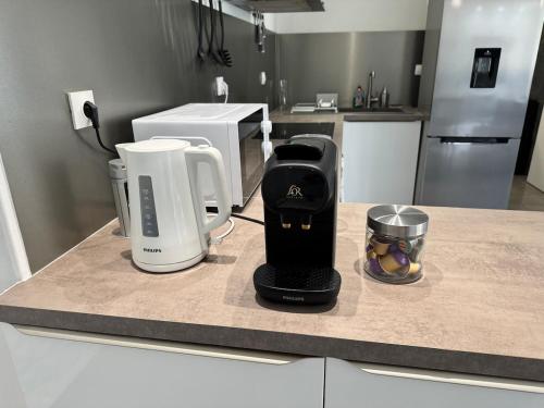 Una cocina o zona de cocina en Le Contemporain