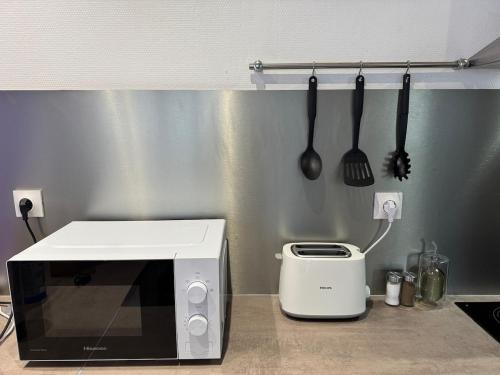 Una cocina o zona de cocina en Le Contemporain