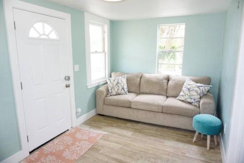 a living room with a couch and a window at Beachside Cottage Walk 2beachocean Center Pets Ok in Daytona Beach
